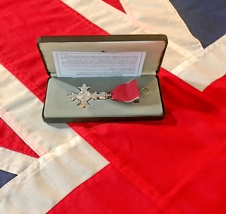 Photo of the MBE awarded to John Mills